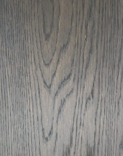 A close up view of an American Girl Oak wood surface.