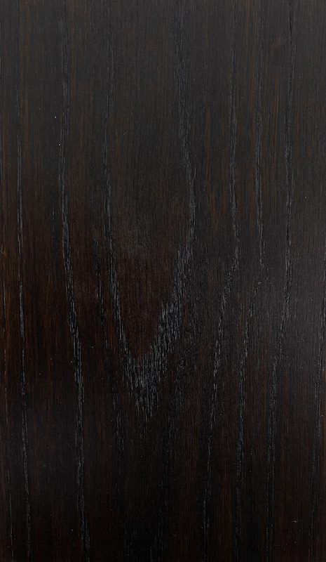 A dark wood background with some type of pattern