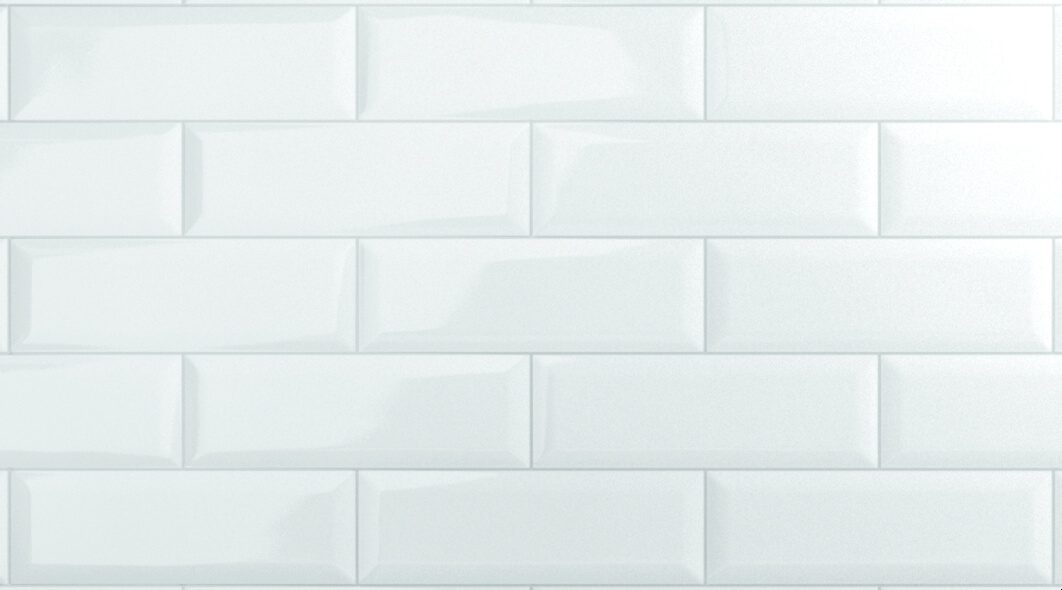 A white tile wall with no grout.