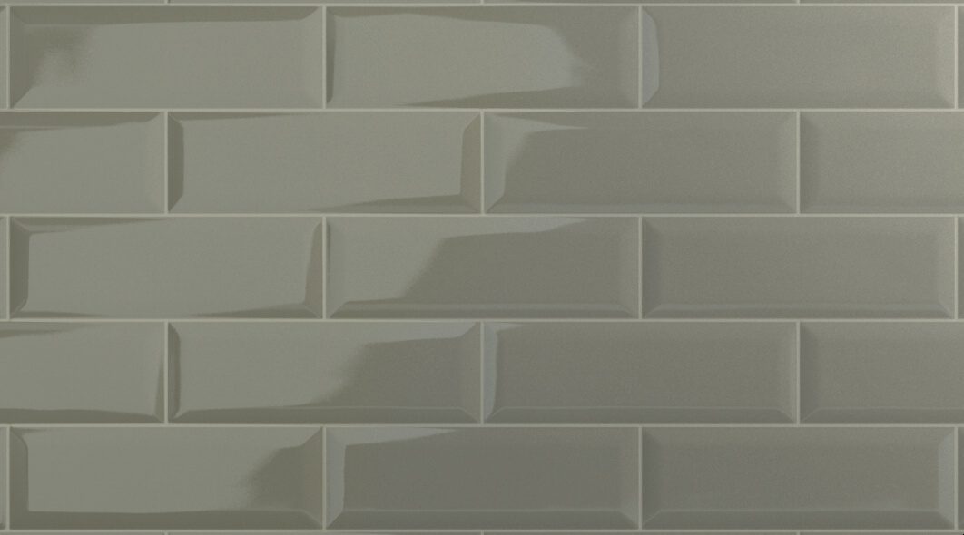 A close up of the wall with a gray tile