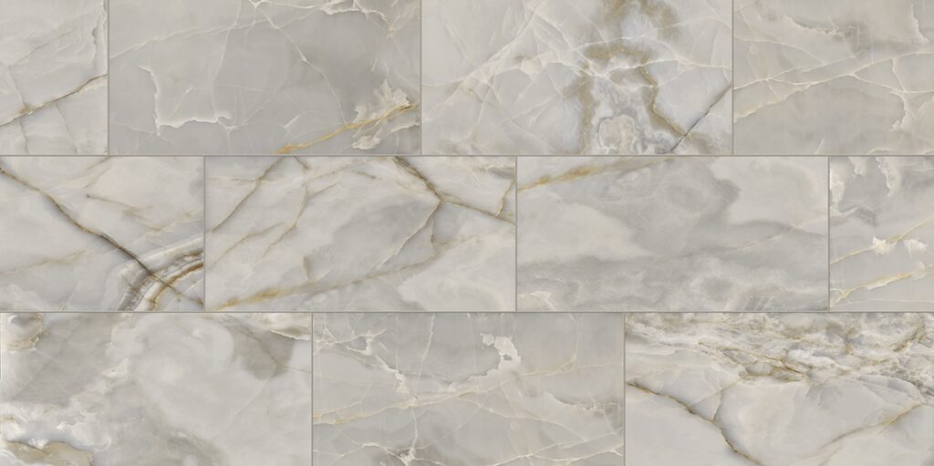 A white marble floor tile pattern that looks like stone.