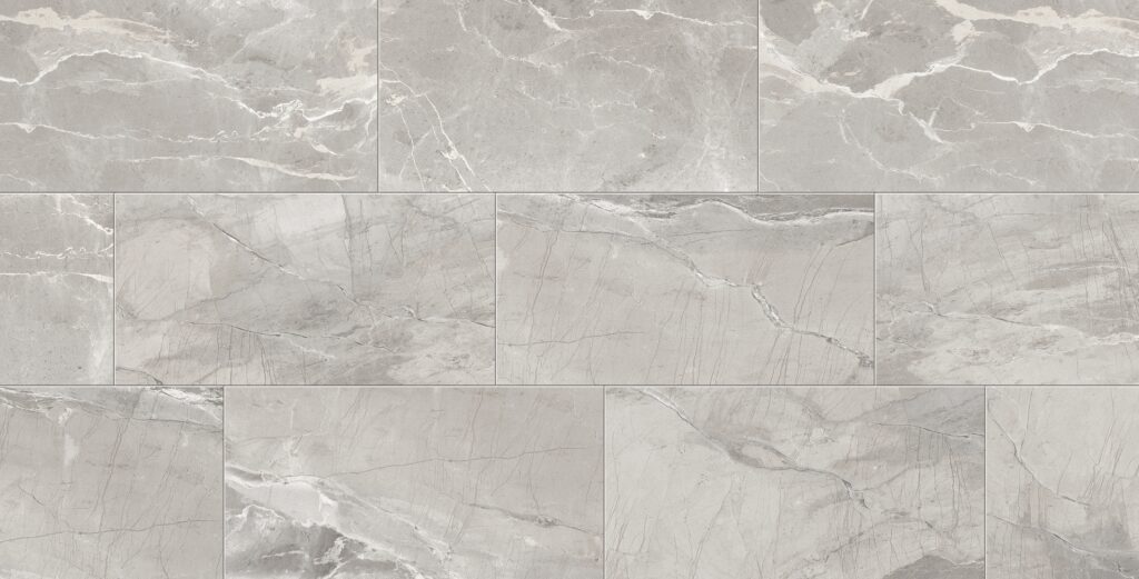 A gray marble tile floor with white grout.