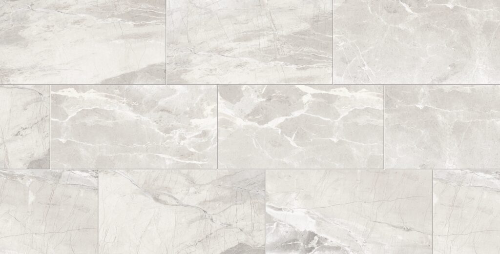 A white marble tile floor with some water