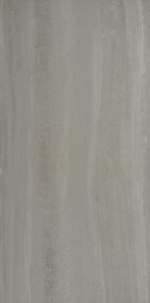 A close up of the surface of a grey wall.