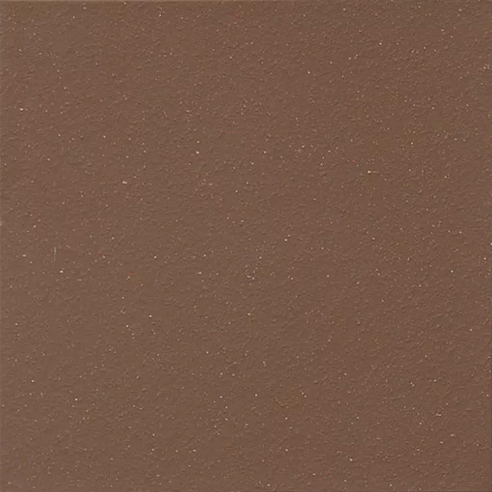 A brown square tile with some white dots on it