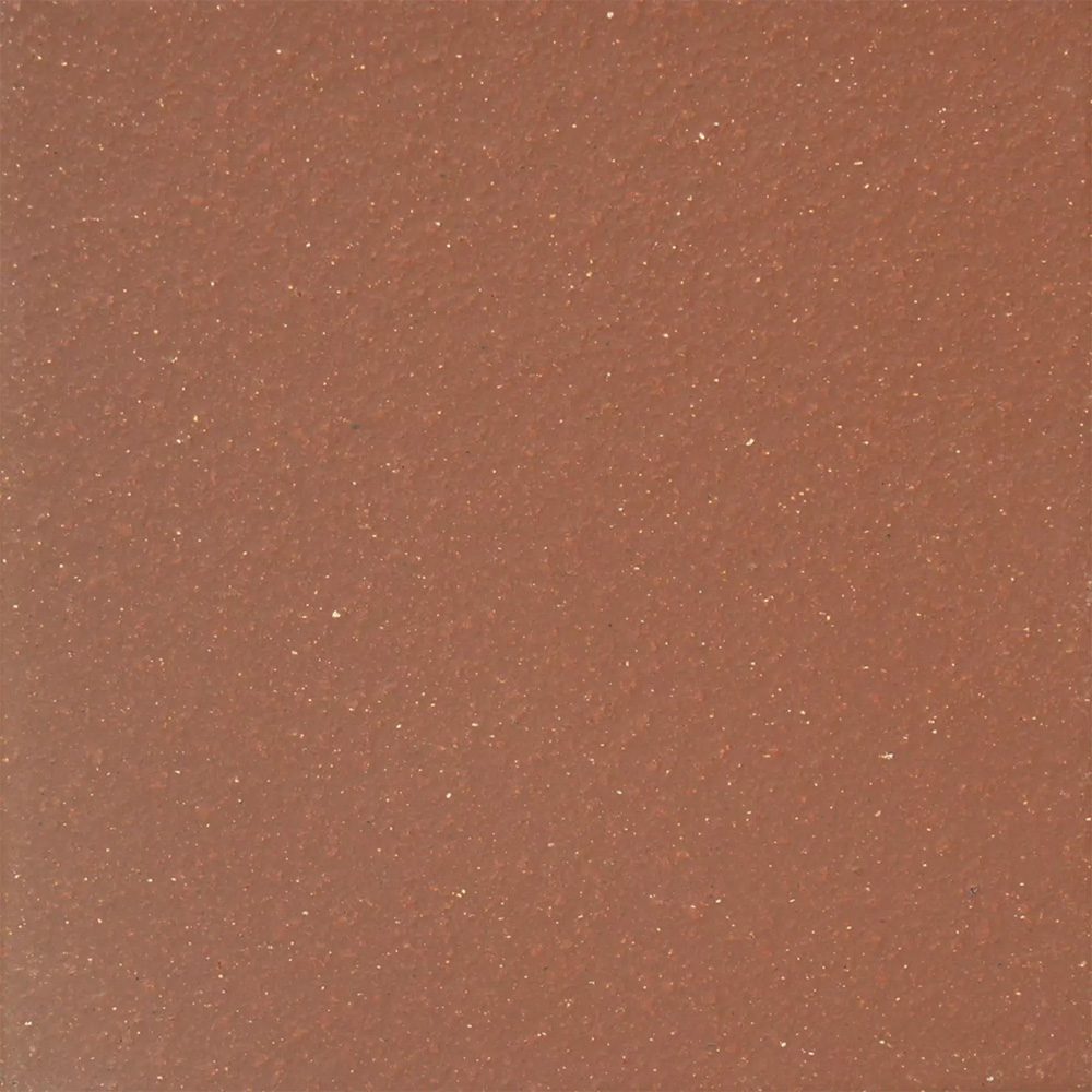 A brown tile background with white specks.