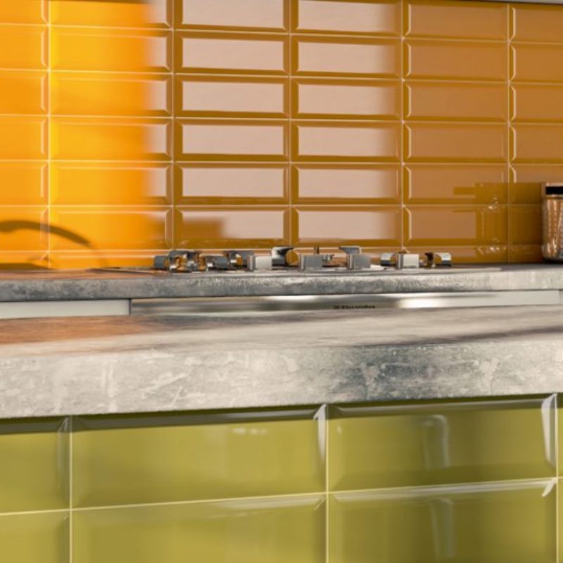 A kitchen with yellow and green 17000 WALL tiled walls.