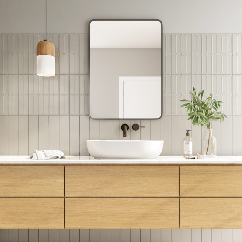 A modern bathroom with 50000 WALL cabinets and a mirror.