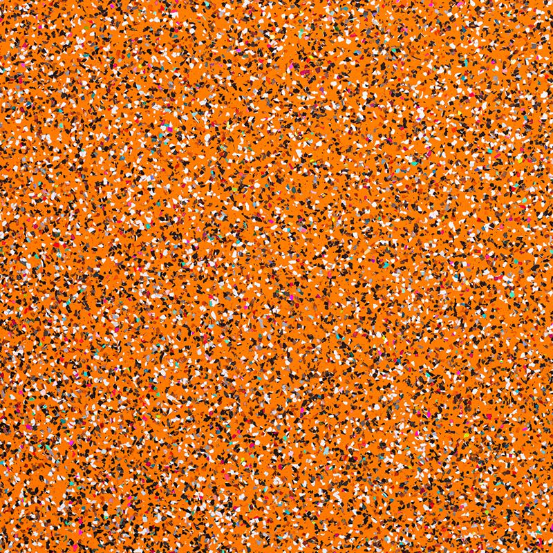 A close up of the orange and brown speckled ground.