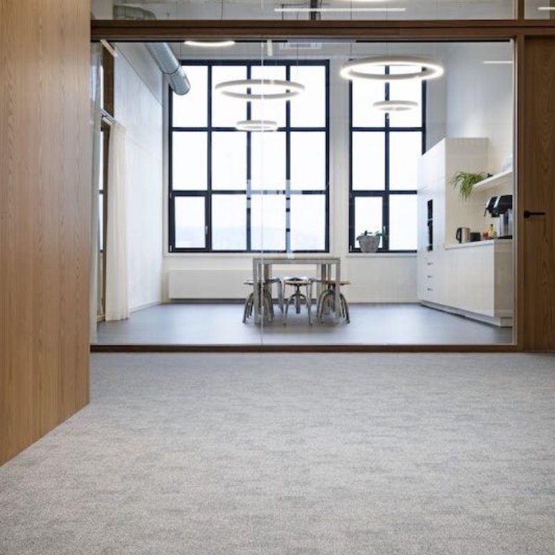 An empty office with Meteor floors and windows.