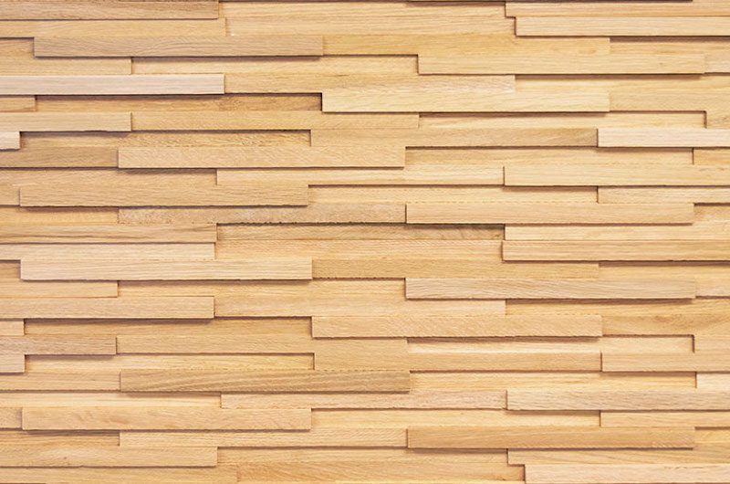 A wall made of wood blocks with different shapes.