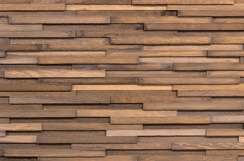 A wall made of wood with many strips