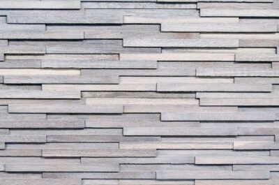 A close up of the wall with many different types of wood.