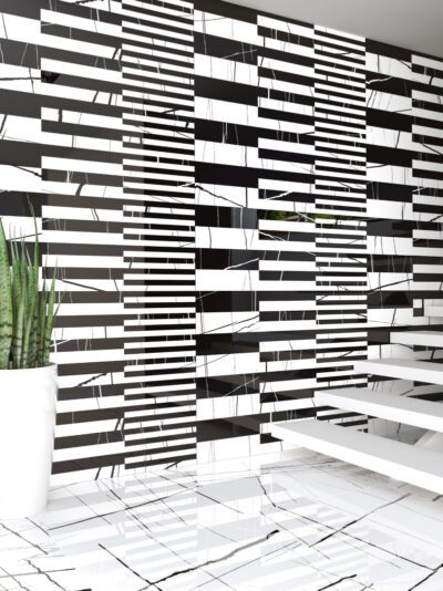A room with a black and white tiled wall.