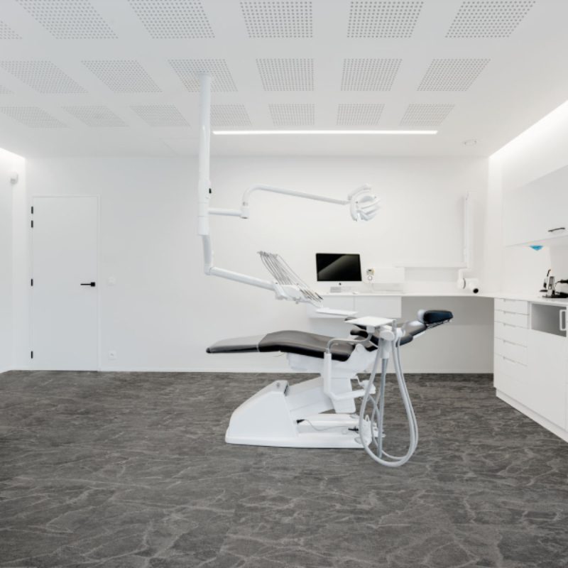 A dentist's office with an Alveri dental chair and equipment.
