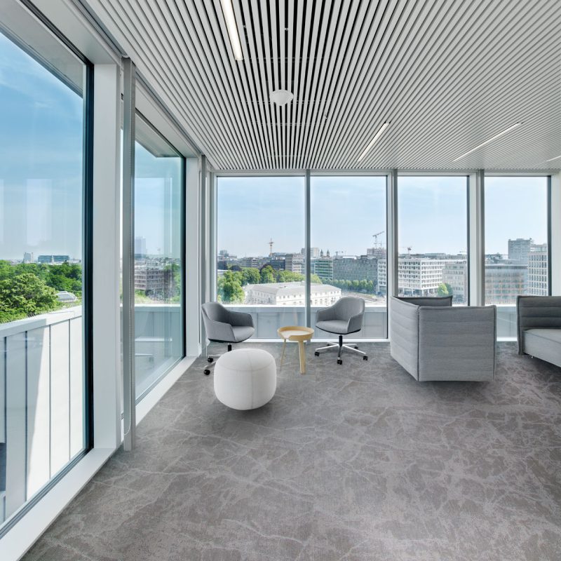 A modern office with an Emperador window overlooking the city.