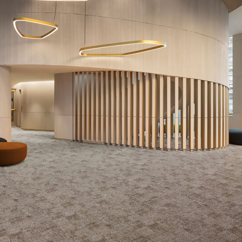 A lobby with a Magellan wooden floor and a Magellan light fixture.