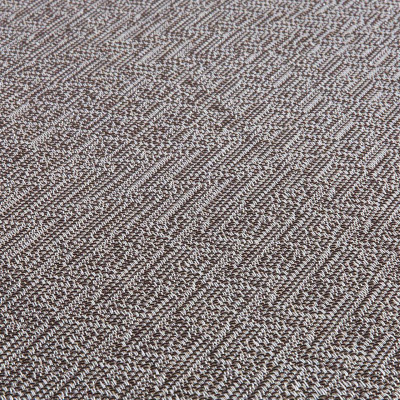 A close up image of a Morion Brown woven rug.