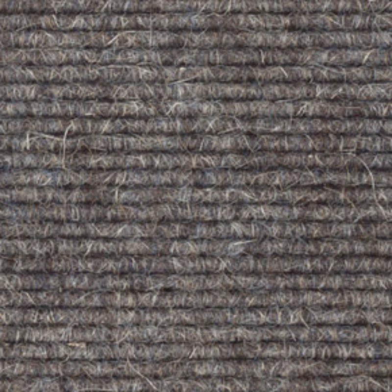 A close up image of a 512 gray carpet.