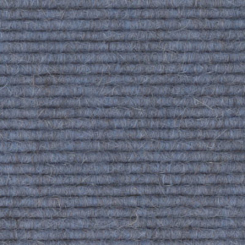 A close up image of a blue 512 carpet.
