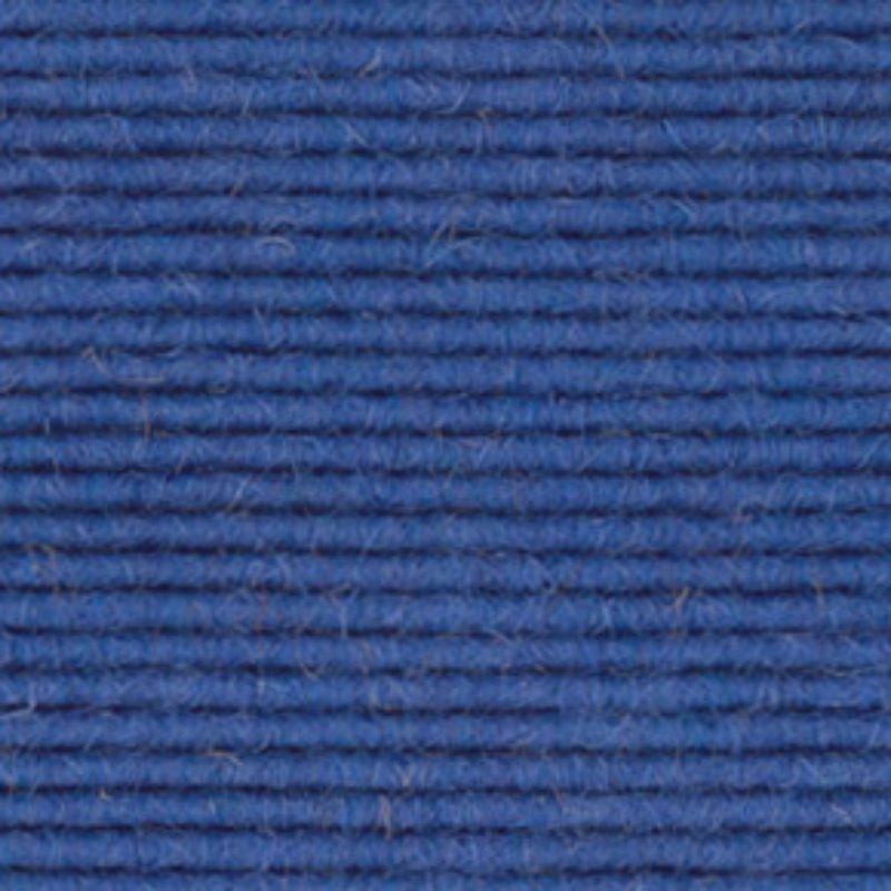 A close up image of a 512 blue wool carpet.