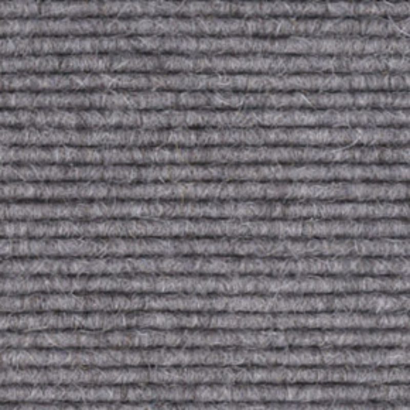 A close-up of a grey carpet.