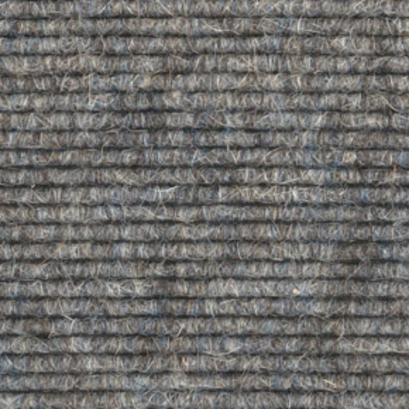 A close up image of a gray carpet.