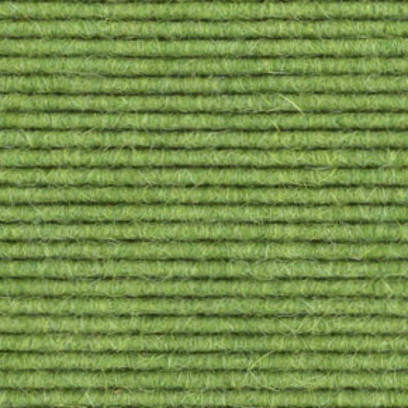 A close up image of a green carpet.