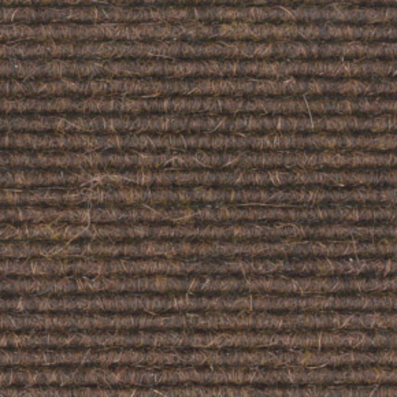 A close up image of a brown carpet.