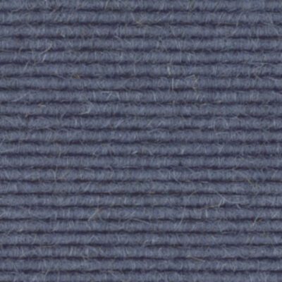 A close up image of a dark blue carpet.