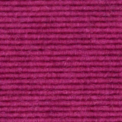 A close up image of a pink wool carpet.